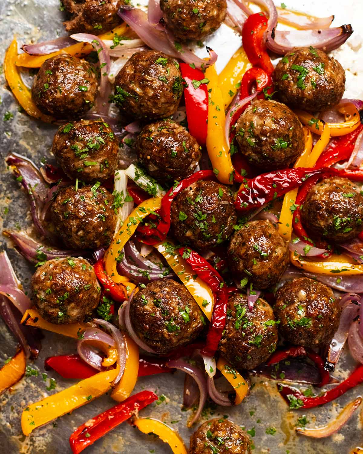 Baked lamb kofta meatballs and vegetables fresh out of the oven